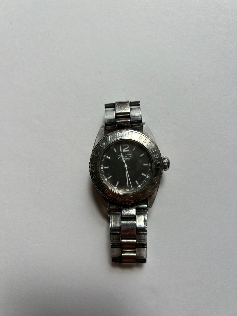 Coach women’s  Silver-Tone Bracelet Watch with Black Dial needs battery